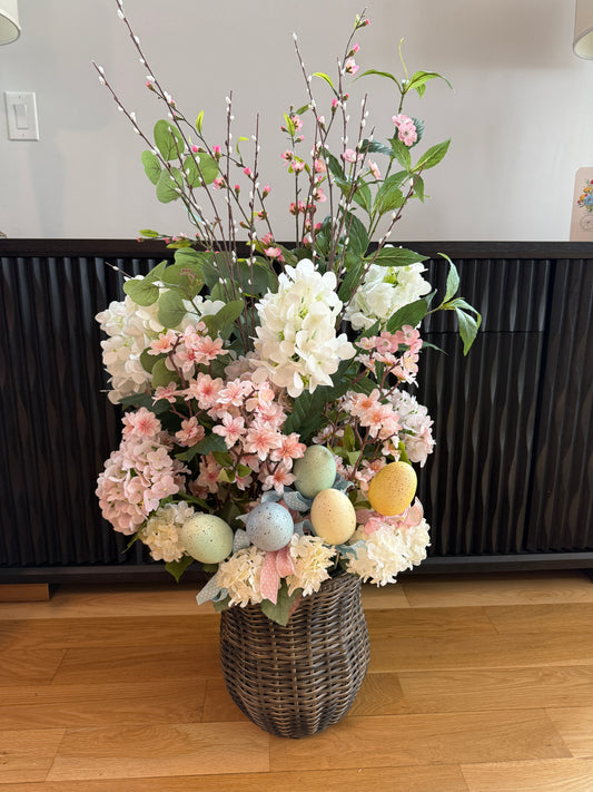 Decorative floral arrangement with pastel eggs 